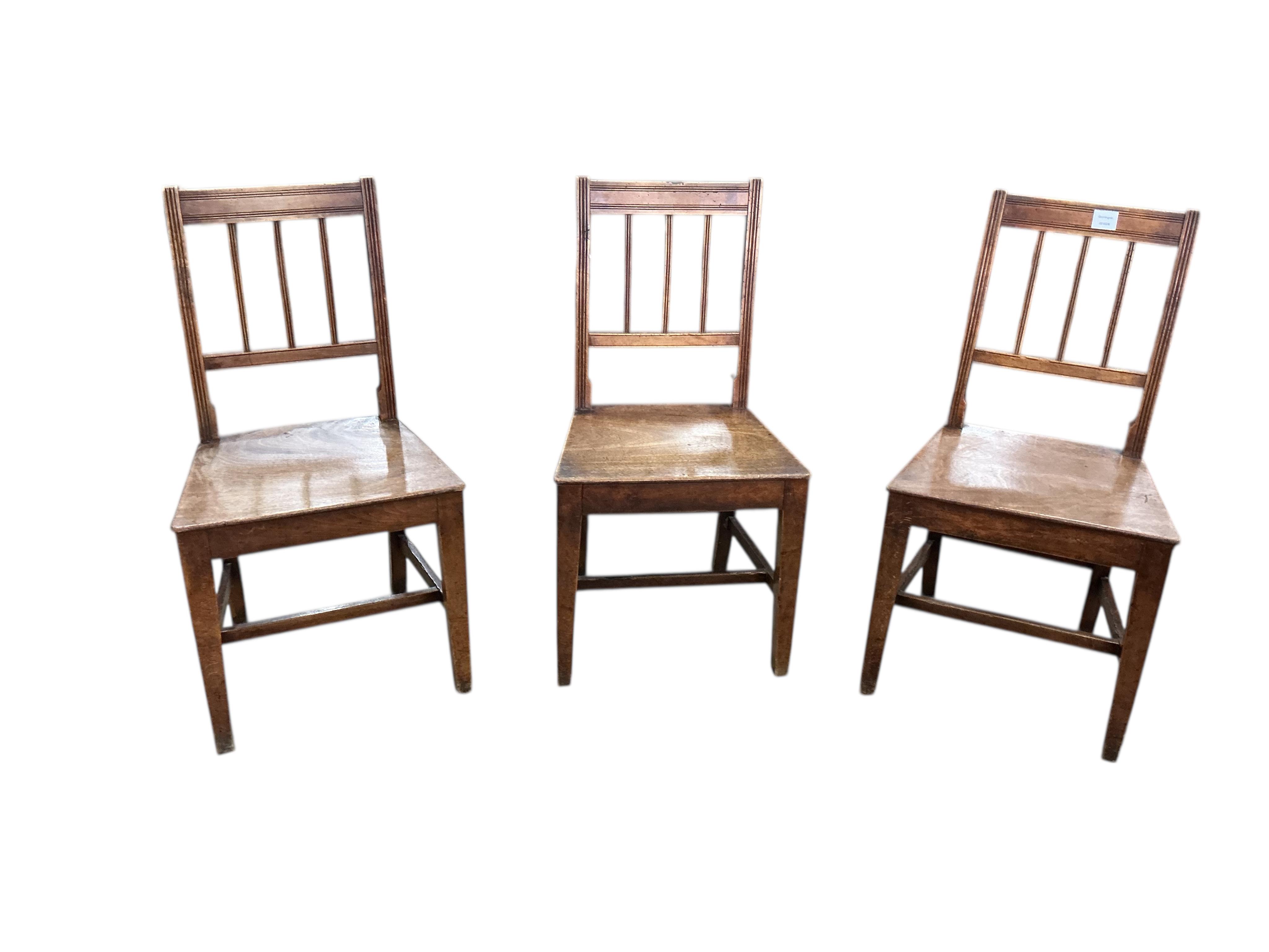 A set of six George III Provincial fruitwood and mahogany dining chairs